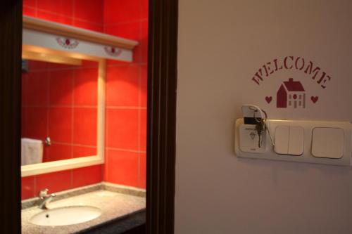 a bathroom with a sink and a mirror at Hotel Mare Datca in Datca