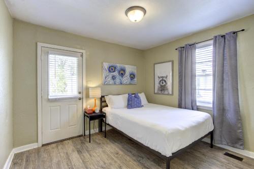 a bedroom with a bed and a window at Peaceful Retreat in Gated Midtown Community in Memphis