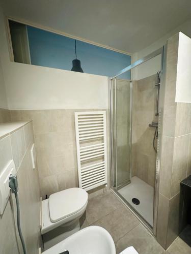 a bathroom with a toilet and a shower at Casa Politi in Parma