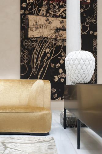 a living room with a couch and a table at Hotel Mercer Sevilla 5 GL in Seville