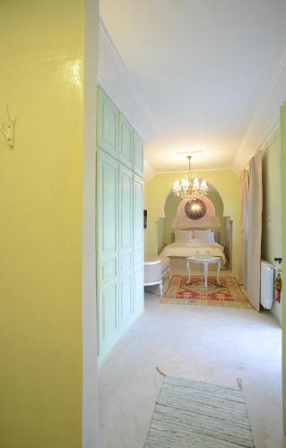 a hallway with a room with a bed and a door at Dar Antonia in Sousse