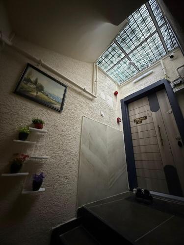 a bathroom with a sink and a mirror and a window at Royal Konaklama Manzara in Bandırma