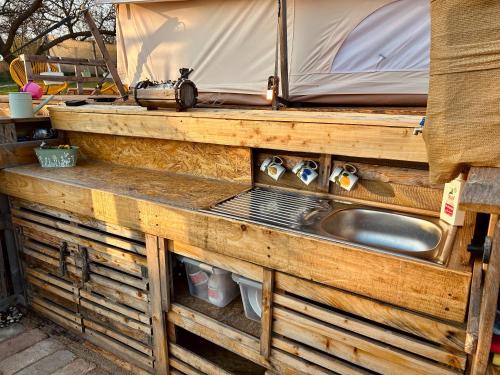 a kitchen with a sink and a tent at Osada na hůrce in Hustopeče