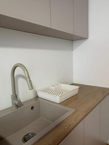 a kitchen counter with a sink and a sink at Privat DAŇO in Lisková