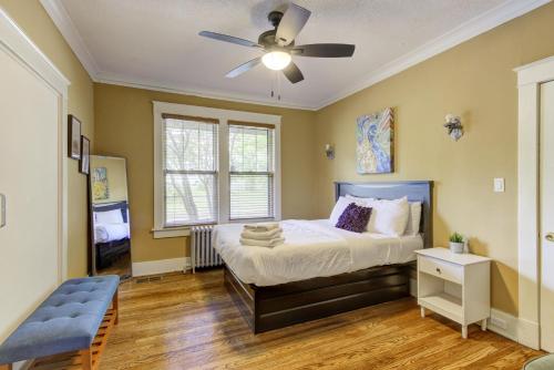 a bedroom with a bed and a ceiling fan at Beautiful Bungalow Stones throw from Cooper Young in Memphis
