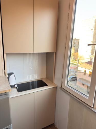 a kitchen with a sink and a window at MN apartment in Yerevan in Yerevan