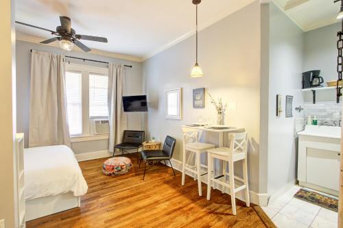 a bedroom with a bed and a table and chairs at Splendid Colonial in Midtown with Parking in Memphis