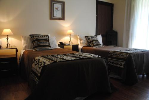 Ένα ή περισσότερα κρεβάτια σε δωμάτιο στο Suter Petit Hotel