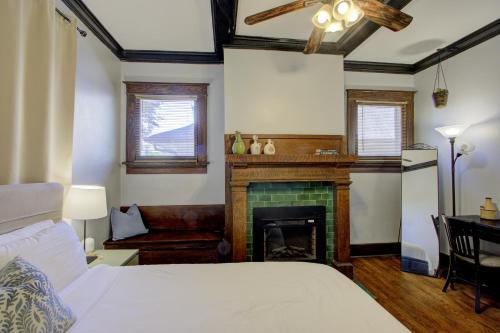a bedroom with a bed and a fireplace at Classic Woodwork and Details in 1912 Colonial in Memphis
