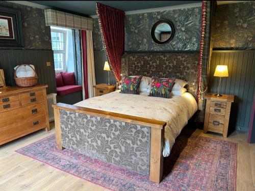 a bedroom with a bed in a room at Stunning country home with private wellness Spa in Strachur