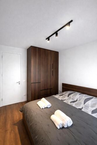 Postel nebo postele na pokoji v ubytování NOVA Apartment