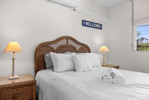 a bedroom with a bed with towels on it at Playa Azul Beach by Otium in Luquillo