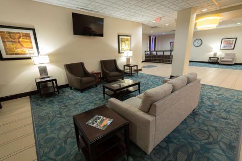 a lobby of a hotel with a couch and chairs at Quality Inn & Suites Downtown Mansfield in Mansfield