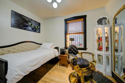 a bedroom with a bed and a chair in it at The Twin Lions: Bespoke Travel Lodge w/ Speakeasy* in Chicago
