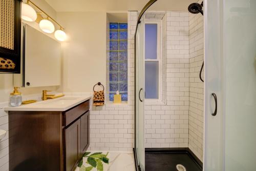 a bathroom with a shower and a sink at The Twin Lions: Bespoke Travel Lodge w/ Speakeasy* in Chicago