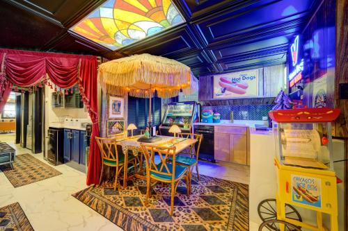 a kitchen with a table with chairs and a window at The Twin Lions: Bespoke Travel Lodge w/ Speakeasy* in Chicago