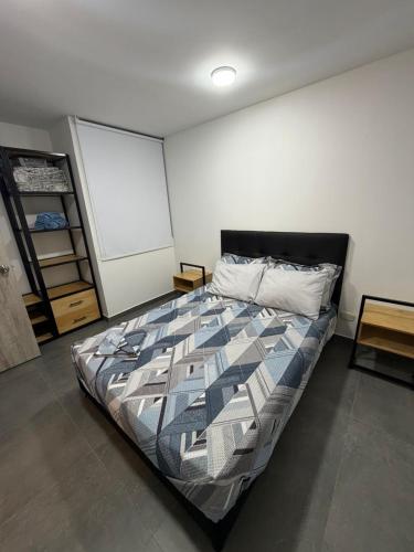 a bedroom with a bed in a room at Comodidad, sol y descanso total in Melgar