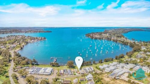 an aerial view of a harbor with boats in the water at Wangi Waterfront Weekender in Wangi Wangi
