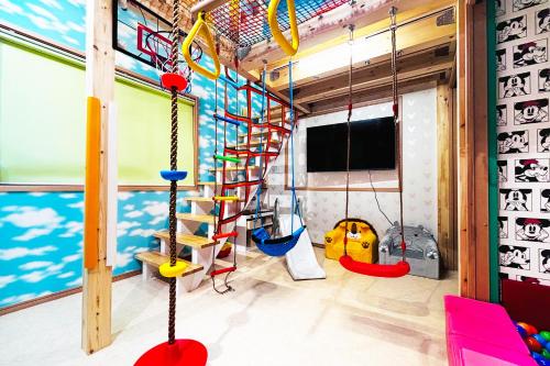 a play room with swings and a ladder at Skytree 12pax Family-Friendly with Indoor Playground in Tokyo