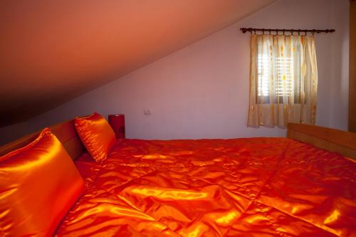 Cama o camas de una habitación en Apartments Ratković