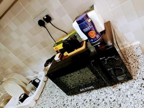a sewing machine sitting on a counter in a bathroom at HomePlug Realty in Ongata Rongai 