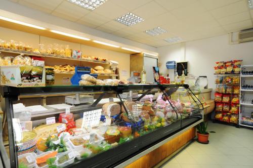 a grocery store aisle with a lot of food at Villaggio Camping Adria in Casal Borsetti