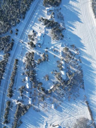 an aerial view of a ski slope with trees in the snow at Kaamasen Kievari in Kaamanen