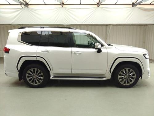 a white suv parked in a garage at Rabbit Car Safari in Dar es Salaam
