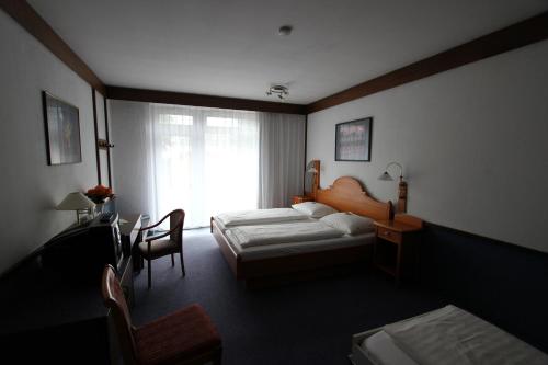 Vuode tai vuoteita majoituspaikassa Hotel Zum Ratsherrn