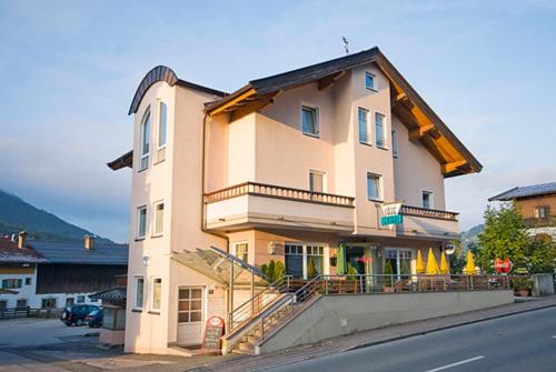 a large building on the side of a street at Apartmenthaus Brixen & Haus Central in Brixen im Thale