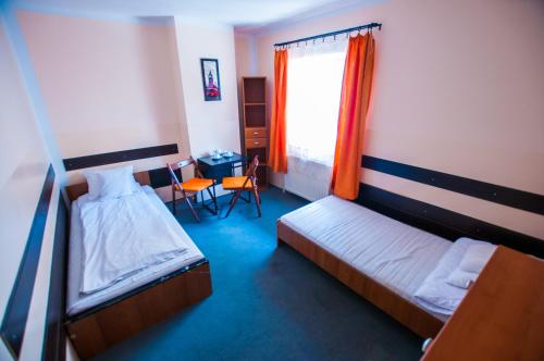 Postel nebo postele na pokoji v ubytování Red Carpet Hostel