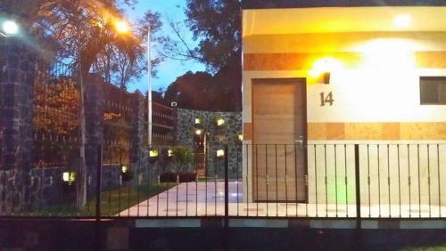 a building with a gate in front of it at Soleil Inn Atlixco in Atlixco