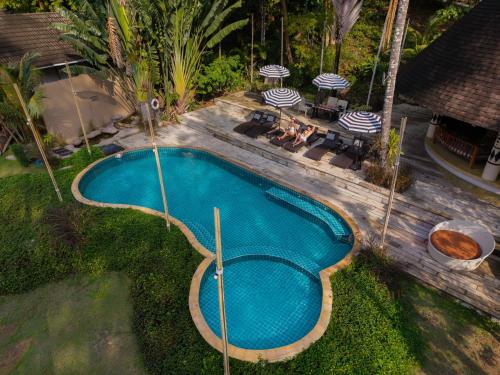 an overhead view of a swimming pool in a backyard at Tolani Resort Koh Kood in Ko Kood