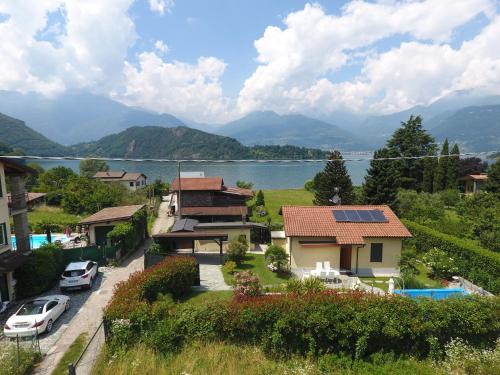 a house with a view of a lake and mountains at Casa Favorita in Colico