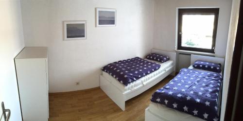 Кровать или кровати в номере Ferienwohnung Seefelder