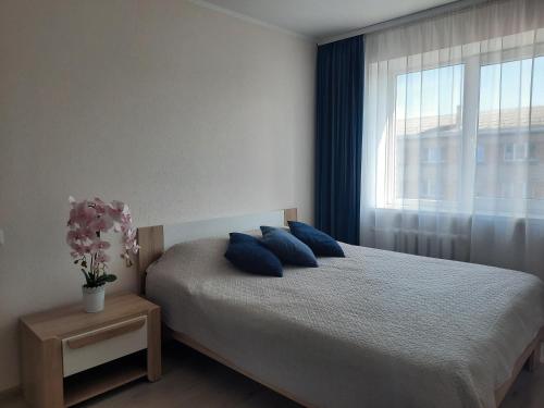 Llit o llits en una habitació de PA Apartment