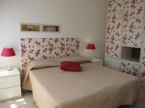 Giường trong phòng chung tại Appartamento A Mare