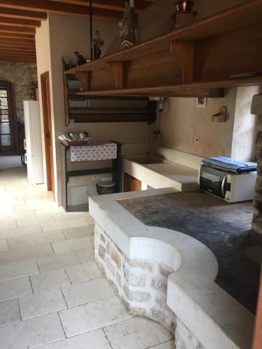 a kitchen with a stone counter top in a room at Vila Lovrečina in Postira