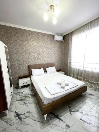 a bedroom with a large bed and a window at Gabala Luxury Nature Villa in Gabala