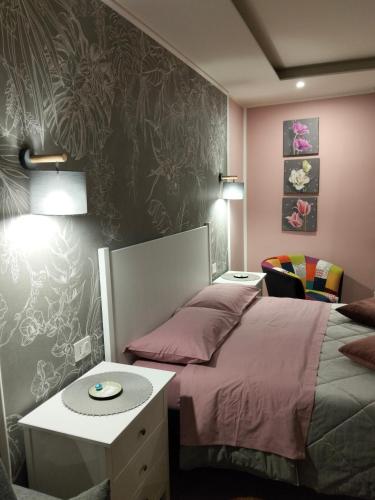 a bedroom with a bed and a table and a tableablish at Residenza del Sepale in Viterbo