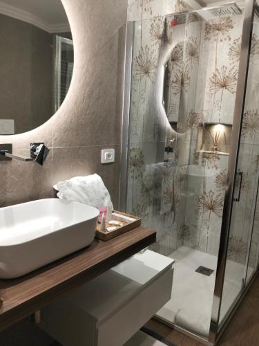 a bathroom with a sink and a shower at Residenza del Sepale in Viterbo