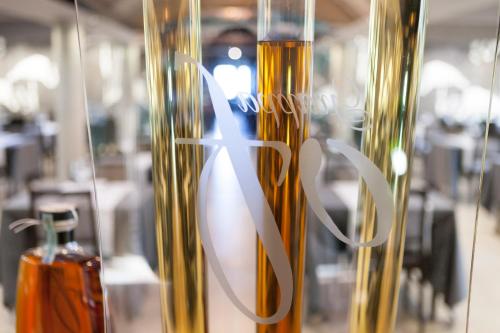 a close up of a vase with a logo on it at Albavilla Hotel & Co in Albavilla