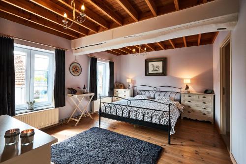 Postel nebo postele na pokoji v ubytování Wellness B&B De Zevenslaper
