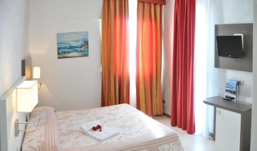 Postel nebo postele na pokoji v ubytování Hotel Venezia