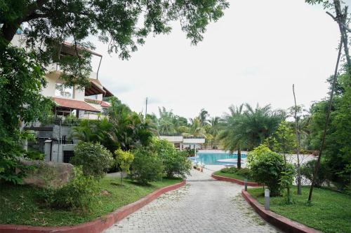 a view of a resort with a swimming pool at Ctrl Alt Heal Sparsh Integrated Wellness Center in Hyderabad