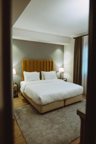 a bedroom with a large bed with white sheets at Mest Hotel Istanbul Sirkeci in Istanbul