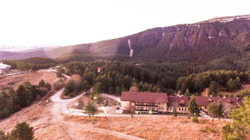 an aerial view of a house in a mountain at Hotel Panorama in Panichishte