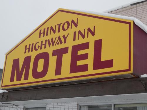 a sign for a michigan motel on top of a building at Hinton Highway Inn in Hinton