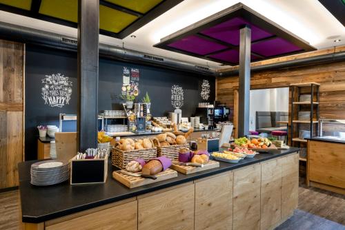 a bakery with a display of bread and pastries at almlust - hotel, apartments, chalets in Flachau
