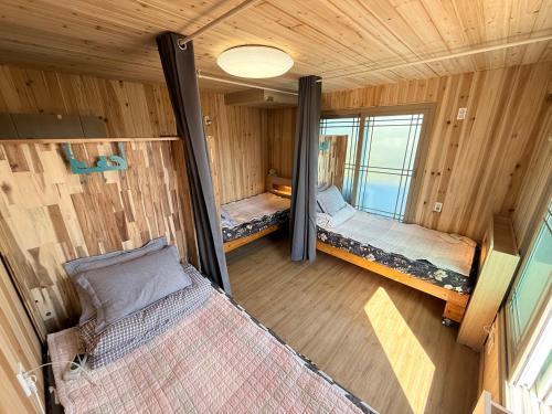 an overhead view of a room with two beds at Bangdigareum B&B in Seogwipo